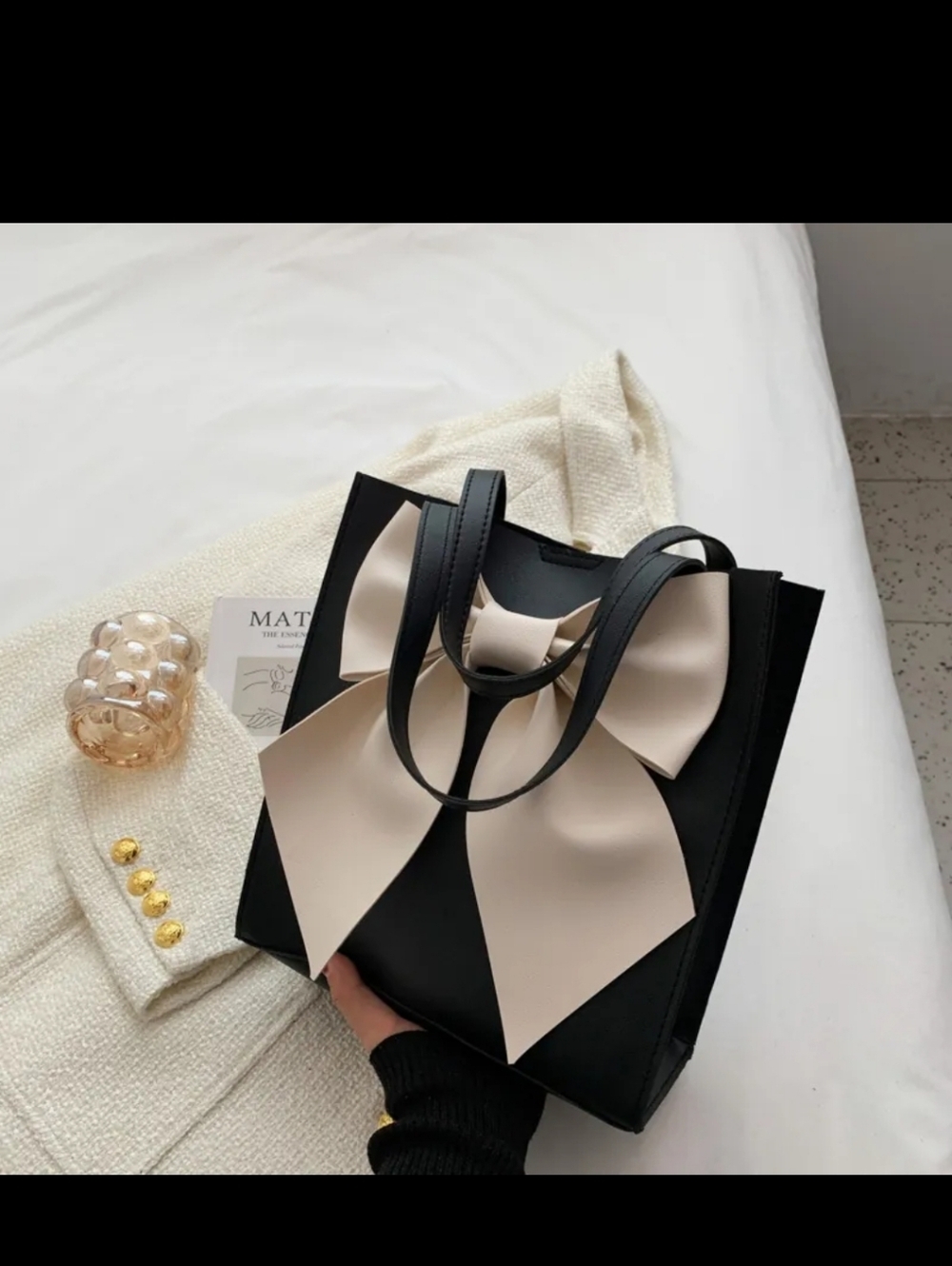 Elegant Black Tote with Cream Bow Accent
